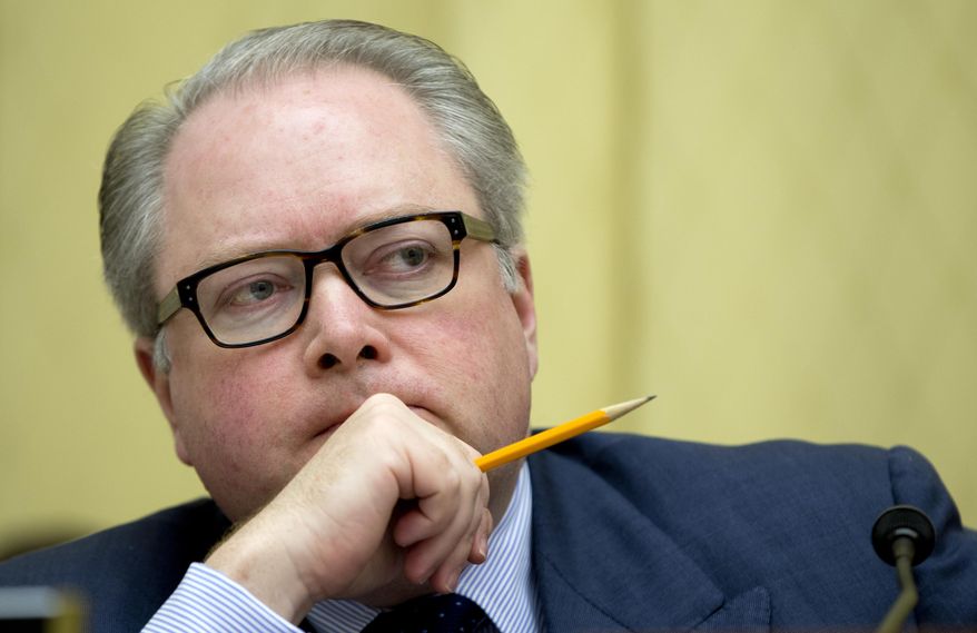 FILE - In this May 8, 2014 file photo, Rep. George Holding, R-N.C., listens to testimony during the House Judiciary Subcommittee on Regulatory Reform, Commercial, and Antitrust Law oversight hearing on "Competition in the Video and Broadband Markets: Proposed Merger of Comcast and Time Warner Cable", on Capitol Hill in Washington.  Holding won't run for reelection, announcing his decision on Friday, Dec. 6, 2019. Holding represents the 2nd Congressional District, which was dramatically altered by the state legislature a few weeks ago because state judges ruled it was likely the previous map was tainted with extreme partisan bias favoring the GOP.  (AP Photo/Carolyn Kaster)