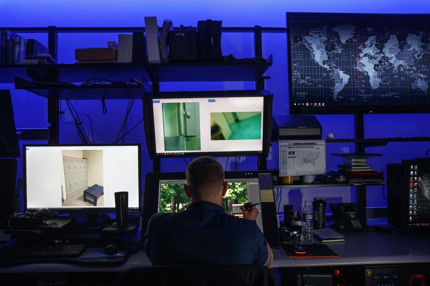 A computer forensic analyst reviews a case inside the Victim Identification Lab, part of Homeland Security's Child Exploitation Investigations Unit, in Fairfax, Va., Friday, Nov. 22, 2019. (AP Photo/Jacquelyn Martin) **FILE**