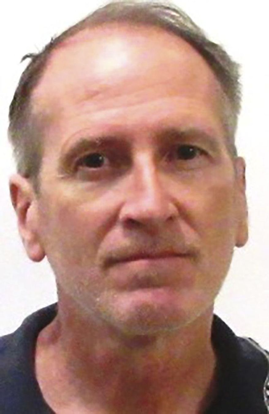 This undated photo provided by the Iowa Department of Corrections shows Kenneth Kerr. The Iowa board responsible for approving lawsuit settlements on behalf of the state decided on a $900,000 settlement in a case filed by three men who worked at the Department of Revenue and claimed they were harassed by Kerr. The lawsuit was filed in 2017 by Daniel Wagner, Lloyd Lofton and Joshua Bates. They claim Kenneth Kerr stalked them and invaded their privacy. (Iowa Department of Corrections via AP)