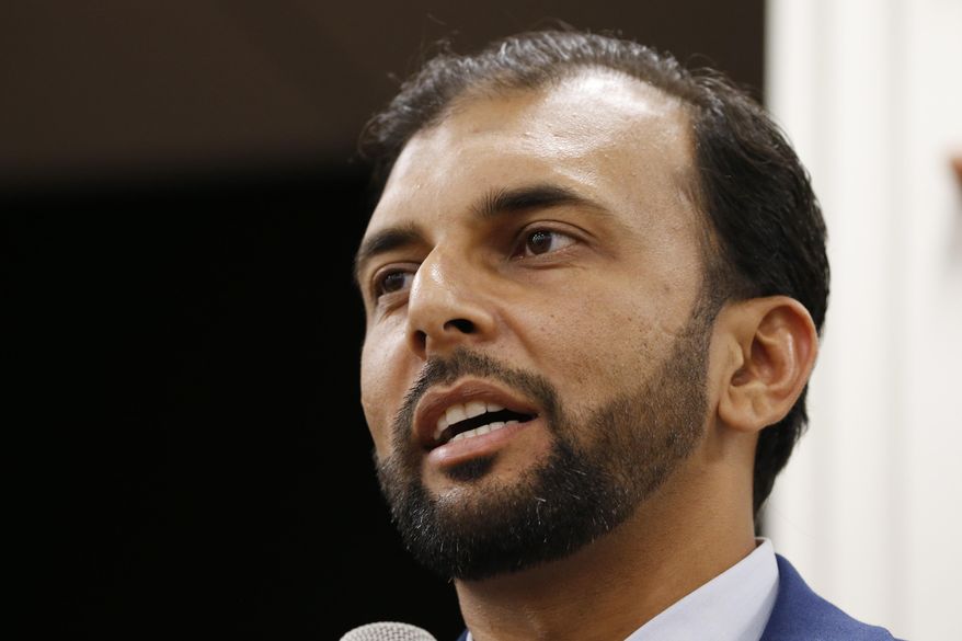 File-This Oct. 8, 2019, file photo shows Democratic candidate for the 28th district for the Virginia Senate, Qasim Rashid, in Fredericksburg, Va. A North Carolina man was convicted Friday, Dec. 6, 2019, of a charge he anonymously threatened to lynch Rasid who ran for a state Senate seat in Virginia, federal prosecutors said. (AP Photo/Steve Helber, File)