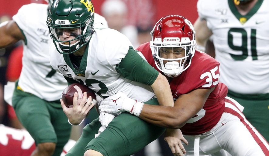 Oklahoma linebacker Nik Bonitto (35) sacks Baylor quarterback Charlie Brewer (12) during an NCAA college football game for the Big 12 Conference championship, Saturday, Dec. 7, 2019, in Arlington, Texas. (Ian Maule/Tulsa World via AP)