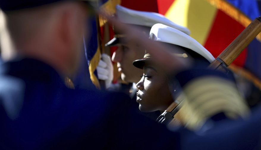Midshipman Brianna Key and the University of Arizona Navy ROTC color guard present the colors during ceremonies at the University of Arizona, Tucson, Saturday, Dec. 7, 2019 commemorating the USS Arizona and Pearl Harbor Day.  The 1941 aerial assault killed more than 2,300 U.S. troops. Nearly half — or 1,177 — were Marines and sailors serving on the USS Arizona, a battleship moored in the harbor. The vessel sank within nine minutes of being hit, taking most of its crew down with it.  (Kelly Presnell/Arizona Daily Star via AP)