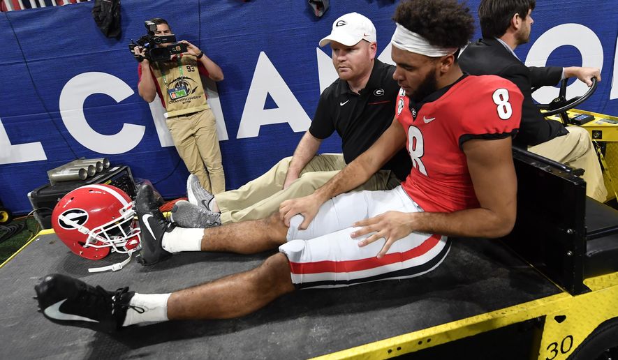 Georgia wide receiver Dominick Blaylock (8) is taken out of the game due to injury against LSU during the first half of the Southeastern Conference championship NCAA college football game, Saturday, Dec. 7, 2019, in Atlanta. (AP Photo/John Amis)