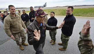 Retired U.S. Air Force Col. Charles McGee, a Tuskegee Airman and decorated veteran of three wars, is welcomed at Dover Air Force Base during a celebration for his 100th birthday Friday, Dec. 6, 2019, in Dover, Delaware. McGee&#39;s birthday is Dec. 7. (AP Photo/David Tulis)