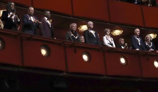 In this file photo, 2019 Kennedy Center honorees, from left, Earth, Wind &amp;amp; Fire members Verdine White, Ralph Johnson and Philip Bailey; singer Linda Ronstadt, conductor Michael Tilson Thomas, actress Sally Field and Sesame Street co-founders Lloyd Morrisett and Joan Ganz Cooney attend the 42nd Annual Kennedy Center Honors at The Kennedy Center on Sunday, Dec. 8, 2019, in Washington. House Republicans are questioning why the iconic performing arts center has laid off staff even after receiving $25 million in federal stimulus money. (Photo by Greg Allen/Invision/AP) **FILE**