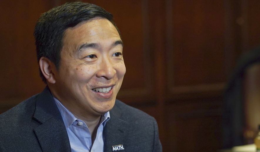 In this Dec. 5, 2019, file photo, Democratic presidential candidate businessman Andrew Yang speaks during an interview with The Associated Press in Chicago. (AP Photo/Teresa Crawford) ** FILE **
