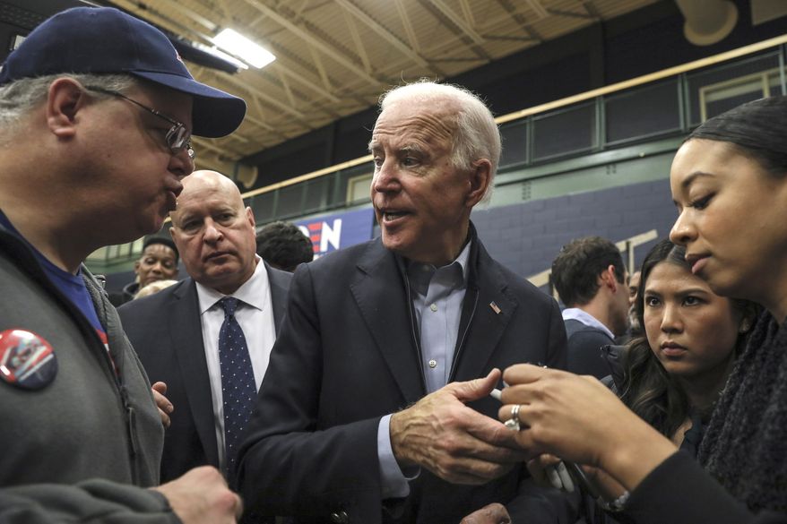 Democratic presidential candidate and former Vice President Joe Biden does a meet-and-greet after speaking at a campaign event in Nashua, N.H. Sunday, Dec. 8, 2019. (AP Photo/ Cheryl Senter)