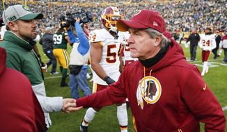 Washington Redskins head coach Bill Callahan shakes hands with Green Bay Packers head coach Matt LaFleur after an NFL football game Sunday, Dec. 8, 2019, in Green Bay, Wis. The Packers won 20-15. (AP Photo/Matt Ludtke)