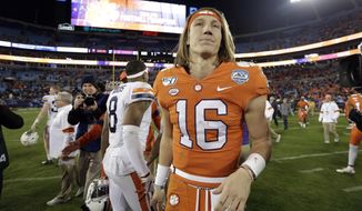 Clemson quarterback Trevor Lawrence (16) is seen following the Atlantic Coast Conference championship NCAA college football game in Charlotte, N.C., Saturday, Dec. 7, 2019. Clemson won 62-17. (AP Photo/Gerry Broome)