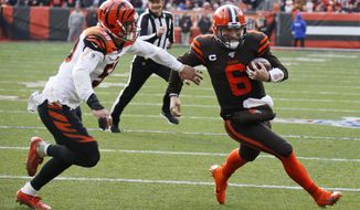 Cleveland Browns quarterback Baker Mayfield (6) rushes for a 7-yard touchdown during the first half of an NFL football game against the Cincinnati Bengals, Sunday, Dec. 8, 2019, in Cleveland. (AP Photo/Ron Schwane)