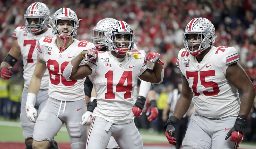 Ohio State wide receiver K.J. Hill (14) celebrates a touchdown during the second half of the Big Ten championship NCAA college football game against Wisconsin, Saturday, Dec. 7, 2019, in Indianapolis. (AP Photo/Michael Conroy) ** FILE **