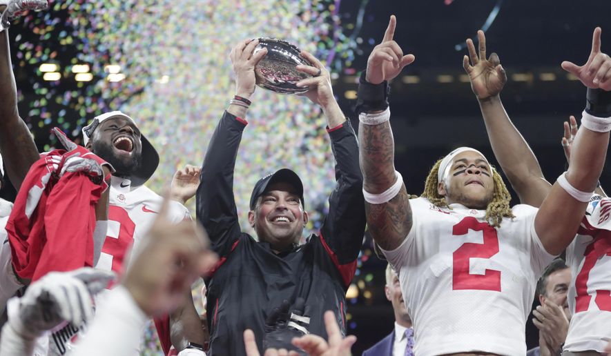 Ohio State coach Ryan Day celebrates after Ohio State defeated Wisconsin in the Big Ten championship NCAA college football game, early Sunday, Dec. 8, 2019, in Indianapolis. Ohio State won 34-21. (AP Photo/Michael Conroy)