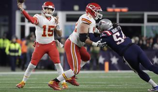 Kansas City Chiefs quarterback Patrick Mahomes. left, passes under pressure from New England Patriots linebacker Dont&#x27;a Hightower, right, in the first half of an NFL football game, Sunday, Dec. 8, 2019, in Foxborough, Mass. (AP Photo/Steven Senne)