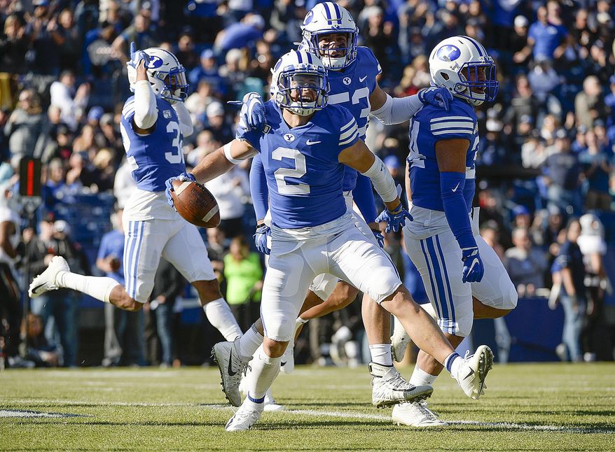 BYU defensive back Austin Lee (2) celebrates his 26-yard interception for a touchdown against Idaho State during an NCAA college football game, Saturday, Nov. 16, 2019, at LaVell Edwards Stadium, in Provo, Utah. (Leah Hogsten/The Salt Lake Tribune via AP)