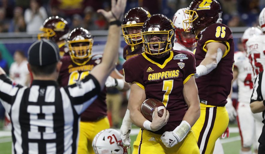Central Michigan quarterback Tommy Lazzaro (7) reacts after scoring a touchdown during the second half of the Mid-American Conference championship NCAA college football game against Miami of Ohio, Saturday, Dec. 7, 2019, in Detroit. (AP Photo/Carlos Osorio)