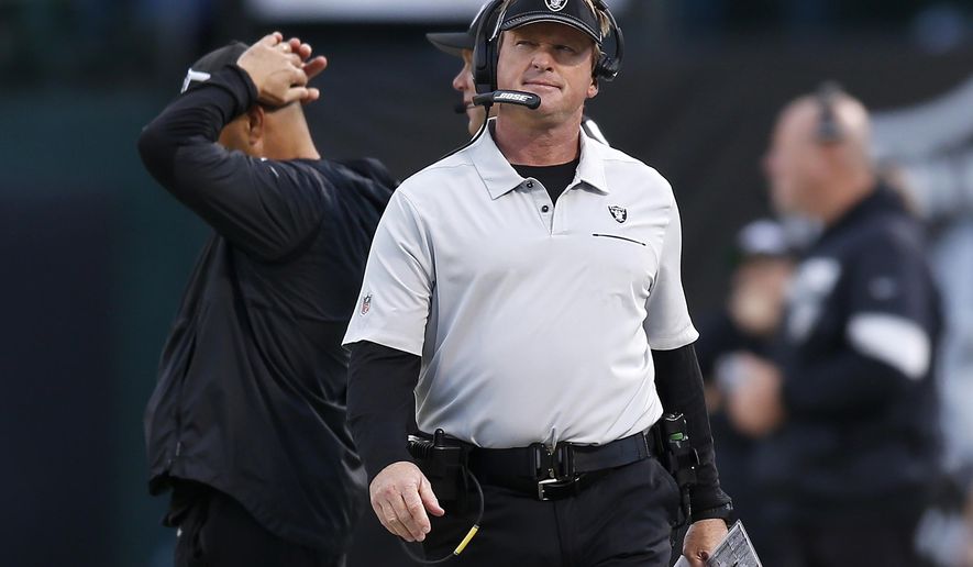 Oakland Raiders head coach Jon Gruden walks on the sideline during the second half of an NFL football game against the Tennessee Titans in Oakland, Calif., Sunday, Dec. 8, 2019. (AP Photo/D. Ross Cameron)
