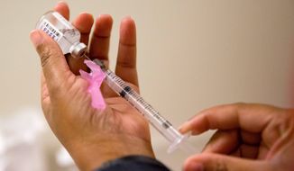 &quot;If there were ever a year to get vaccinated against the flu, this is it,&quot; Dr. William Schaffner, an infectious disease specialist at Vanderbilt University said. (Associated Press file photo)