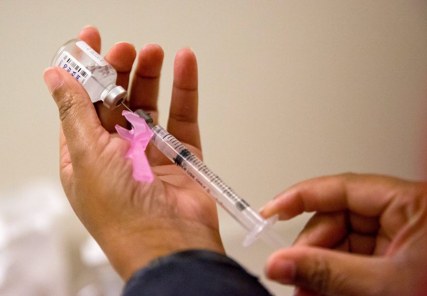 &quot;If there were ever a year to get vaccinated against the flu, this is it,&quot; Dr. William Schaffner, an infectious disease specialist at Vanderbilt University said. (Associated Press file photo)
