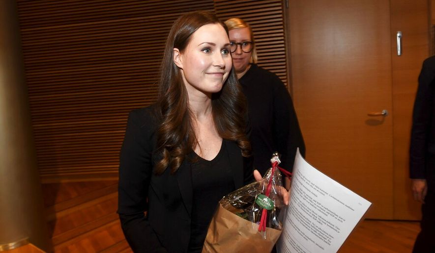 The candidate for the next Prime Minister of Finland, Sanna Marin, smiles after she won the SDP&#39;s Prime Minister candidate vote against Antti Lindtman, in Helsinki, Finland, Sunday, Dec. 8, 2019. A 34-year-old minister and lawmaker has been tapped to become Finland&#39;s youngest prime minister ever and its third female government head, replacing former Cabinet leader who resigned Tuesday. (Vesa Moilanen/Lehtikuva via AP)