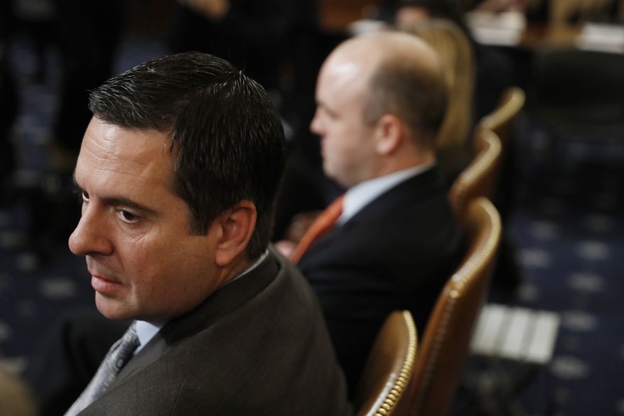 Rep. Devin Nunes, R-Calif, left, the ranking member of the House Intelligence Committee, listens as the House Judiciary Committee hears investigative findings in the impeachment inquiry of President Donald Trump, Monday, Dec. 9, 2019, on Capitol Hill in Washington. (AP Photo/Andrew Harnik)