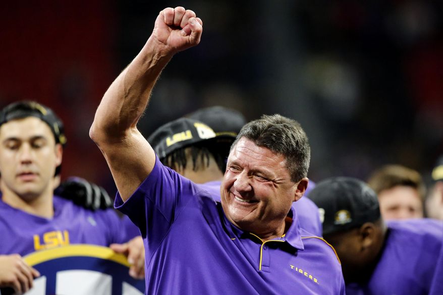 FILE - In this Dec. 7, 2019, file photo, LSU coach Ed Orgeron celebrates after the team&#39;s win over Georgia in an NCAA college football game for the Southeastern Conference championship, in Atlanta. Top-ranked LSU has the SEC’s coach of the year in Ed Orgeron, as The Associated Press All-Southeastern Conference football team was announced Monday, Dec. 9, 2019. (C.B. Schmelter/Chattanooga Times Free Press via AP, File)