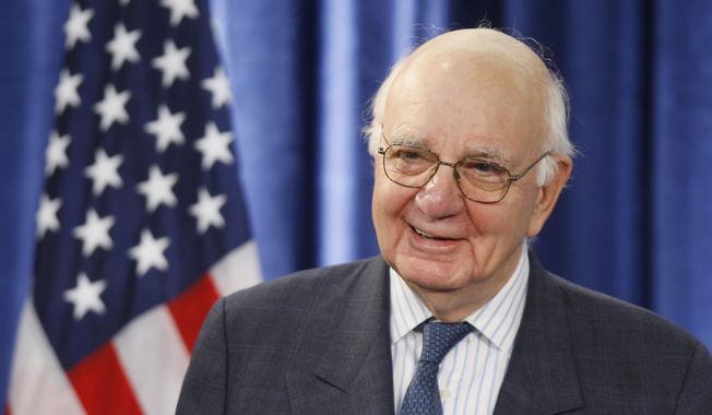 In this Nov. 26, 2008, file photo former Federal Reserve Chairman Paul Volcker, chairman-designate of the Economic Recovery Advisory Board, listens to President-elect Barack Obama, not pictured, as he speaks during a news conference in Chicago. Volcker, the former Federal Reserve chairman died on Sunday, Dec. 8, 2019, according to his office, He was 92. (AP Photo/Charles Dharapak, File)