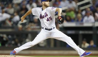 FILE - In this Sept. 15, 2019, file photo, New York Mets starting pitcher Zack Wheeler (45) winds up during the first inning of a baseball game against the Los Angeles Dodgers, in New York. Two people familiar with the deal say the Philadelphia Phillies and right-hander Zack Wheeler have agreed on a five-year, $118 million contract.Both people spoke to The Associated Press on condition of anonymity Wednesday, Dec. 4, 2019, because they weren&#39;t authorized to announce the signing. (AP Photo/Kathy Willens, File)