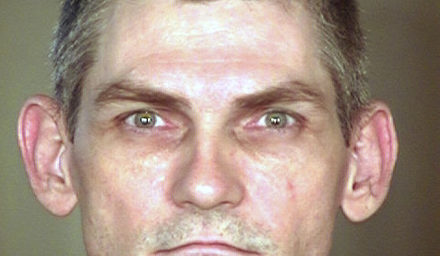 FILE - This undated booking file photo provided by the Arizona Department of Corrections shows James Erin McKinney. The U.S. Supreme Court will hear an appeal Wednesday, Dec. 11, 2019, from McKinney, an Arizona death row inmate who is seeking a sentencing retrial in two 1991 killings. (Arizona Department of Corrections via AP)