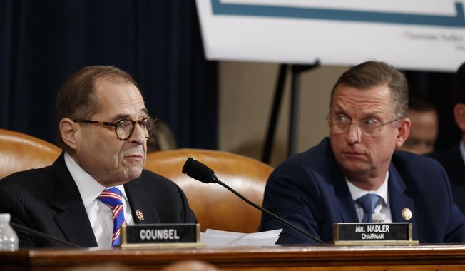 House Judiciary Committee Chairman Rep. Jerrold Nadler, D-N.Y., left, gives his closing statement as ranking member Rep. Doug Collins, R-Ga., listens during the House Judiciary Committee hearing on the constitutional grounds for the impeachment of President Donald Trump, on Capitol Hill in Washington, Wednesday, Dec. 4, 2019 (AP Photo/Alex Brandon) **FILE**
