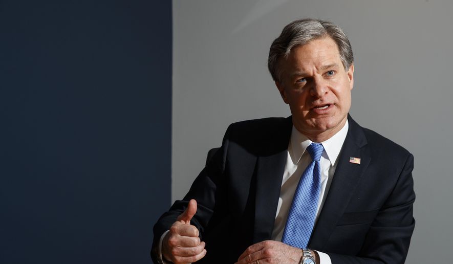 FBI Director Christopher Wray speaks during an interview with The Associated Press, Monday, Dec. 9, 2019, in Washington. (AP Photo/Jacquelyn Martin) ** FILE **