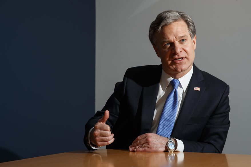 FBI Director Christopher Wray speaks during an interview with The Associated Press, Monday, Dec. 9, 2019, in Washington. (AP Photo/Jacquelyn Martin) ** FILE **