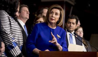 House Speaker Nancy Pelosi of Calif., accompanied by House Congress members speaks at a news conference to discuss the United States Mexico Canada Agreement (USMCA) trade agreement, Tuesday, Dec. 10, 2019, on Capitol Hill in Washington. (AP Photo/Andrew Harnik)