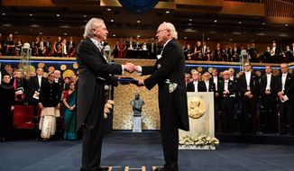 Austrian author Peter Handke, left, receives the 2019 Nobel Prize from King Carl Gustaf of Sweden, during the Nobel Prize award ceremony at the Stockholm Concert Hall, in Stockholm, Tuesday, Dec. 10, 2019. (Jonas Ekstromer/TT News Agency via AP)