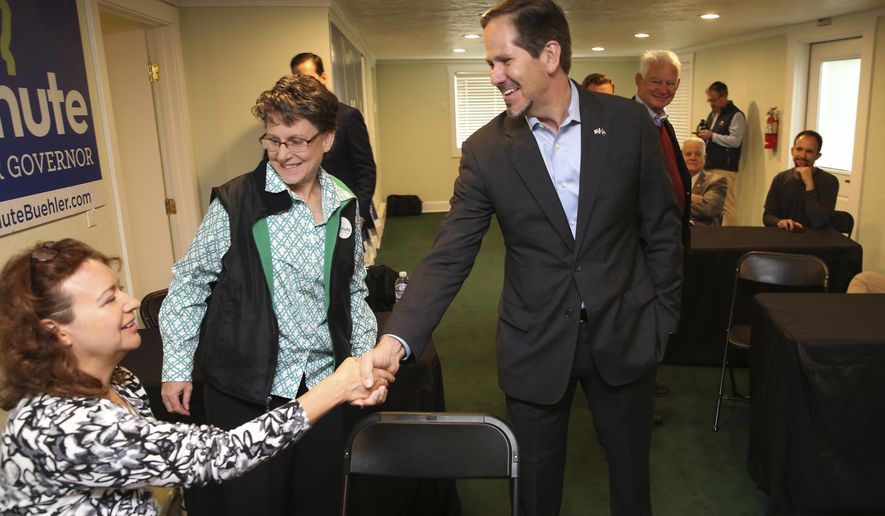 FILE - In this Nov. 5, 2018, file photo, Knute Buehler, center, then a Republican candidate for Oregon governor, thanks campaign workers at his office during a tour of the state in Eugene, Ore. Buehler has has announced his candidacy for a seat in the U.S. House being vacated by Republican Greg Walden. (Chris Pietsch/The Register-Guard via AP, file)