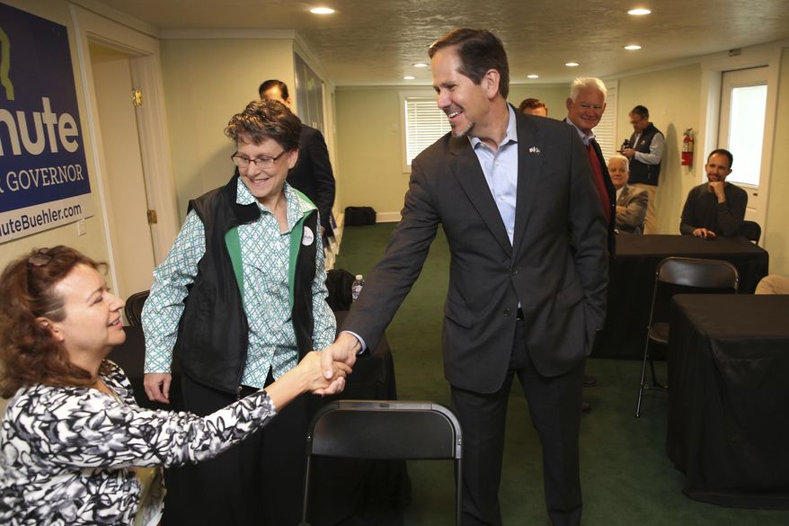 FILE - In this Nov. 5, 2018, file photo, Knute Buehler, center, then a Republican candidate for Oregon governor, thanks campaign workers at his office during a tour of the state in Eugene, Ore. Buehler has has announced his candidacy for a seat in the U.S. House being vacated by Republican Greg Walden. (Chris Pietsch/The Register-Guard via AP, file)