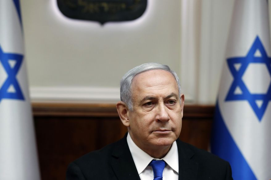 Israeli Prime Minister Benjamin Netanyahu attends the weekly cabinet meeting in Jerusalem on Sunday, Dec. 8, 2019. (Ronen Zvulun/ Pool photo via AP)
