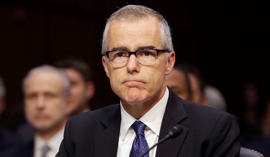 In this file photo, then-acting FBI Director Andrew McCabe listens on Capitol Hill in Washington, Thursday, May 11, 2017, while testifying before a Senate Intelligence Committee hearing on major threats facing the U.S. (AP Photo/Jacquelyn Martin) ** FILE **
