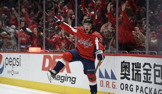 Washington Capitals right wing T.J. Oshie (77) celebrates his goal during the second period of an NHL hockey game against the Boston Bruins, Wednesday, Dec. 11, 2019, in Washington. This was Oshie&#39;s second goal of the night. (AP Photo/Nick Wass)