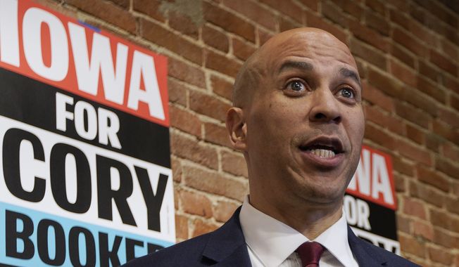 In this Dec. 5, 2019 photo, Democratic presidential candidate Sen. Cory Booker, D-N.J. speaks to reporters before a campaign stop in Council Bluffs, Iowa. (AP Photo/Nati Harnik) ** FILE **