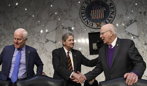 Sen. John Kennedy, R-La., center, shakes hands with Sen. Patrick Leahy, D-Vt., right, as Sen. John Cornyn, R-Texas, left, sits down before the start of a Senate Judiciary Committee hearing on Capitol Hill in Washington, Wednesday, Dec. 11, 2019, to look at the Inspector General&#39;s report on alleged abuses of the Foreign Intelligence Surveillance Act. (AP Photo/Susan Walsh)