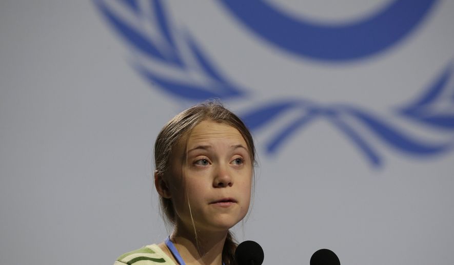 Swedish climate activist Greta Thunberg addresses a plenary of U.N. climate conference at the COP25 summit in Madrid, Spain, Wednesday, Dec. 11, 2019. Thunberg is in Madrid where a global U.N.-sponsored climate change conference is taking place. (AP Photo/Paul White)