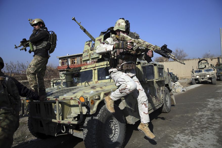 Security personnel arrive near the site of an attack near the Bagram Air Base In Parwan province of Kabul, Afghanistan, Wednesday, Dec. 11, 2019. A powerful suicide bombing Wednesday targeted an under-construction medical facility near the Bagram Air Base, the main American base north of the capital Kabul, the U.S. military said. (AP Photo/Rahmat Gul)