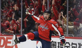 Washington Capitals right wing T.J. Oshie (77) celebrates his goal during the second period of an NHL hockey game against the Boston Bruins, Wednesday, Dec. 11, 2019, in Washington. This was Oshie&#39;s second goal of the night. (AP Photo/Nick Wass)