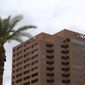 FILE - This Tuesday, April 16, 2019 file photo shows a view of the Arizona Public Service utility company in Phoenix. The new head of Arizona&#39;s largest electric utility has apologized for a faulty bill calculator that was supposed to help customers find the cheapest rate plan but instead steered 10,000 of them to higher-priced options. (AP Photo/Ross D. Franklin,File)