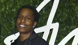 In this file photo dated Monday, Dec. 2, 2019, ASAP Rocky poses for photographers upon arrival at the British Fashion Awards in central London. (File photo by Joel C Ryan/Invision/AP)