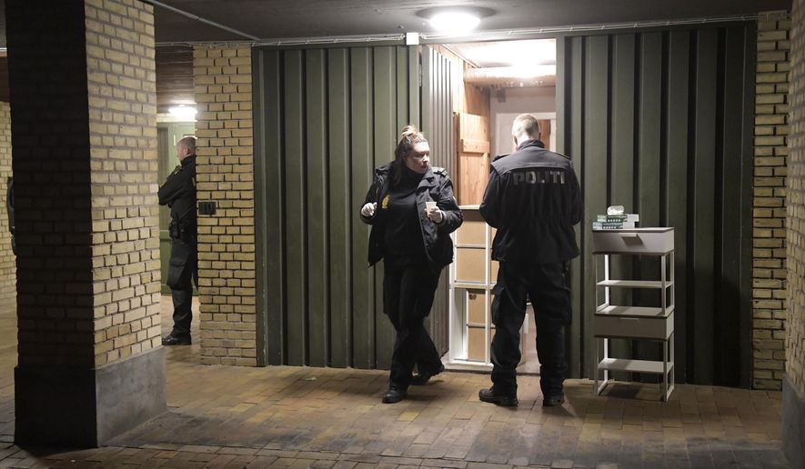 Police conduct searches at Ramsingvej in Copenhagen, Wednesday, Dec. 11, 2019. Police in Denmark police say they have carried out “a comprehensive and coordinated police action” across the country based on suspicions of preparations "for terrorist attacks with a militant, Islamist motive.” The Copenhagen police department and the Danish domestic security service were planning a news conference for later Wednesday. (Nils Meilvang/Ritzau Scanpix via AP)