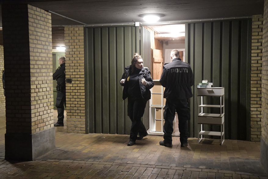 Police conduct searches at Ramsingvej in Copenhagen, Wednesday, Dec. 11, 2019. Police in Denmark police say they have carried out “a comprehensive and coordinated police action” across the country based on suspicions of preparations "for terrorist attacks with a militant, Islamist motive.” The Copenhagen police department and the Danish domestic security service were planning a news conference for later Wednesday. (Nils Meilvang/Ritzau Scanpix via AP)