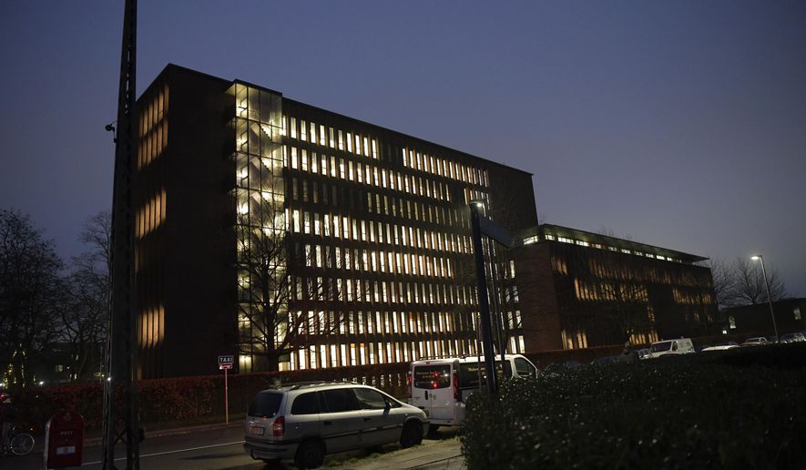 Police conduct searches at Ramsingvej in Copenhagen, Wednesday, Dec. 11, 2019. Police in Denmark police say they have carried out “a comprehensive and coordinated police action” across the country based on suspicions of preparations "for terrorist attacks with a militant, Islamist motive.” The Copenhagen police department and the Danish domestic security service were planning a news conference for later Wednesday. (Nils Meilvang/Ritzau Scanpix via AP)