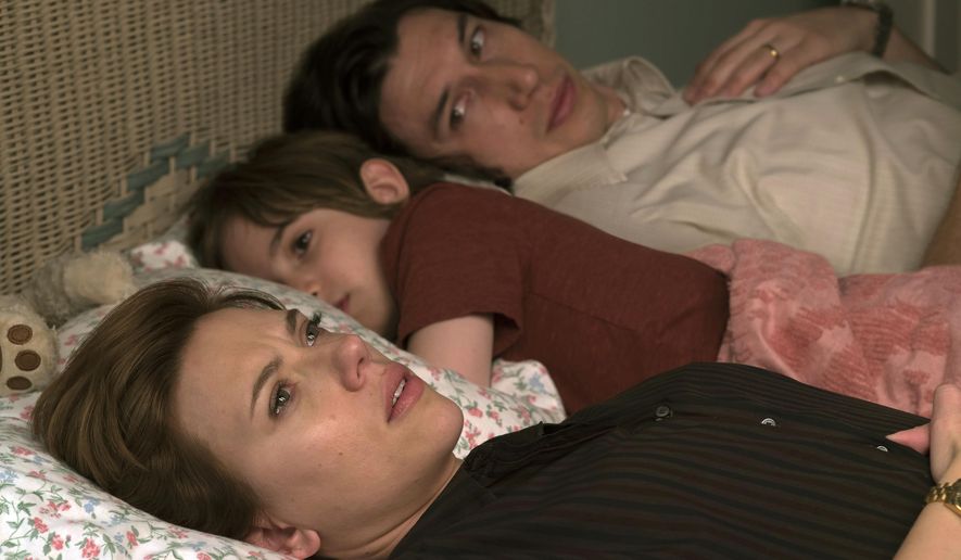 This image released by Netflix shows Scarlett Johansson, left, and Adam Driver in "Marriage Story." On Monday, Dec. 9, 2019, Johansson was nominated for a Golden Globe for best actress in a motion picture drama for her role in the film. (Netflix via AP)