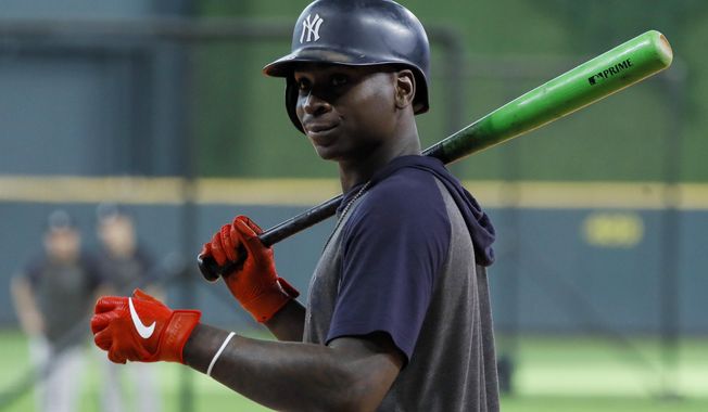 FILE - In this Saturday, Oct. 19, 2019, file photo, New York Yankees shortstop Didi Gregorius prepares to take batting practice before Game 6 of baseball&#x27;s American League Championship Series against the Houston Astros in Houston. Gregorius is joining manager Joe Girardi in Philadelphia, agreeing with the Phillies on a $14 million, one-year contract, a person familiar with the deal told The Associated Press, late Tuesday, Dec. 10, 2019. (AP Photo/Matt Slocum, File)